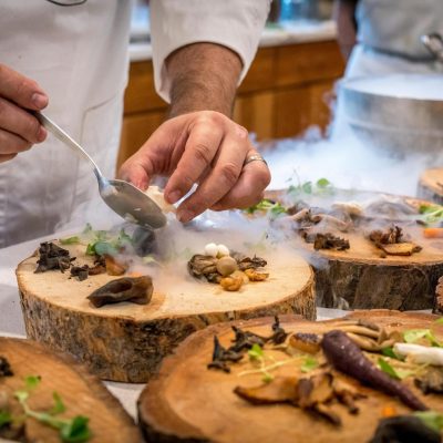 Chef Preparing Vegetable Dish on Tree Slab