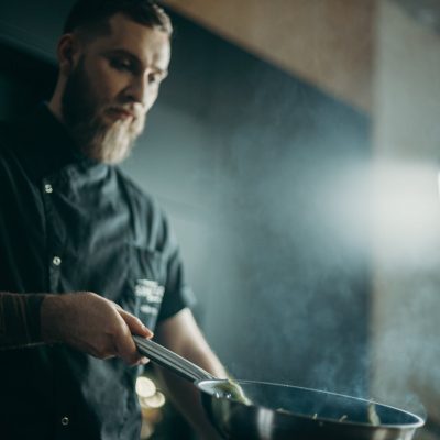 Man Holding Frying Pan